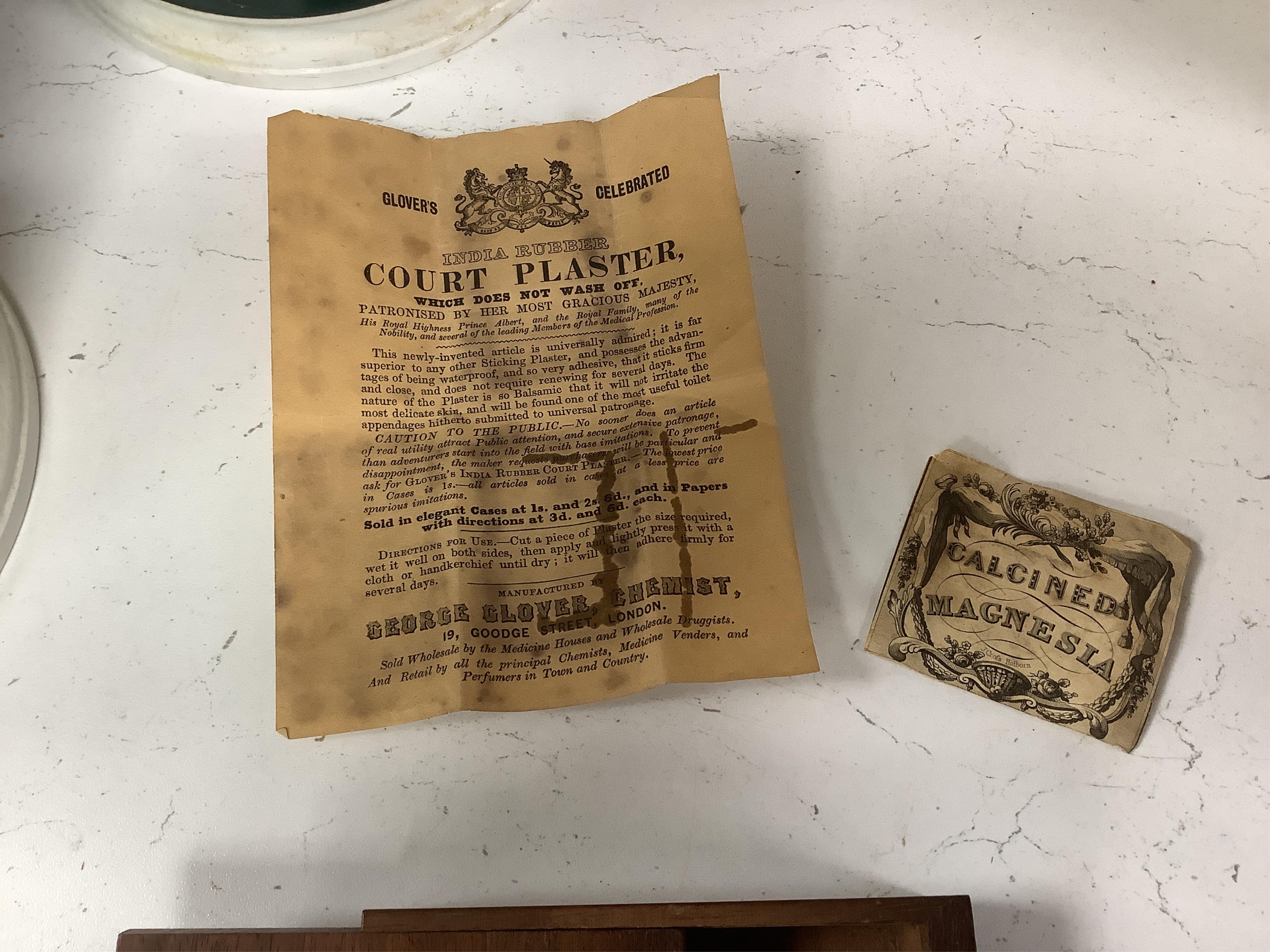 A 19th century mahogany apothecary cabinet, interior with fitting compartments containing twenty-one glass bottles, most with stoppers, five drawers with ivory knobs containing a miniature pestle and water, mixing glasse